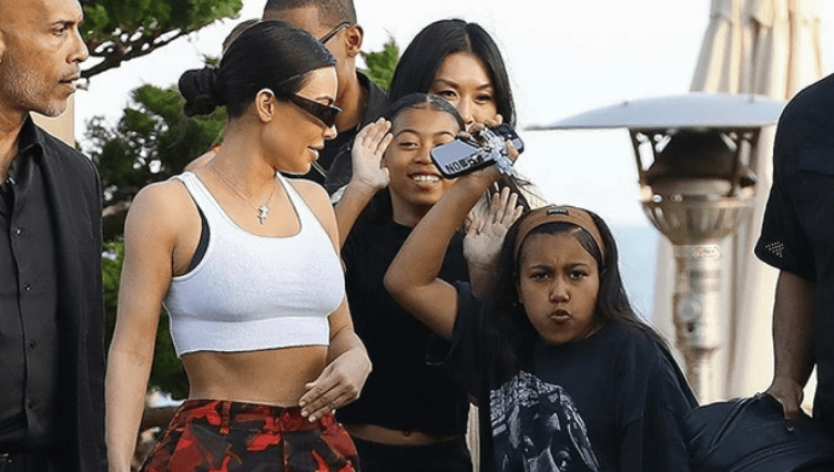 North, 9, and Kim Kardashian dine at Nobu Malibu in grunge-inspired clothing, as shown in the photos.