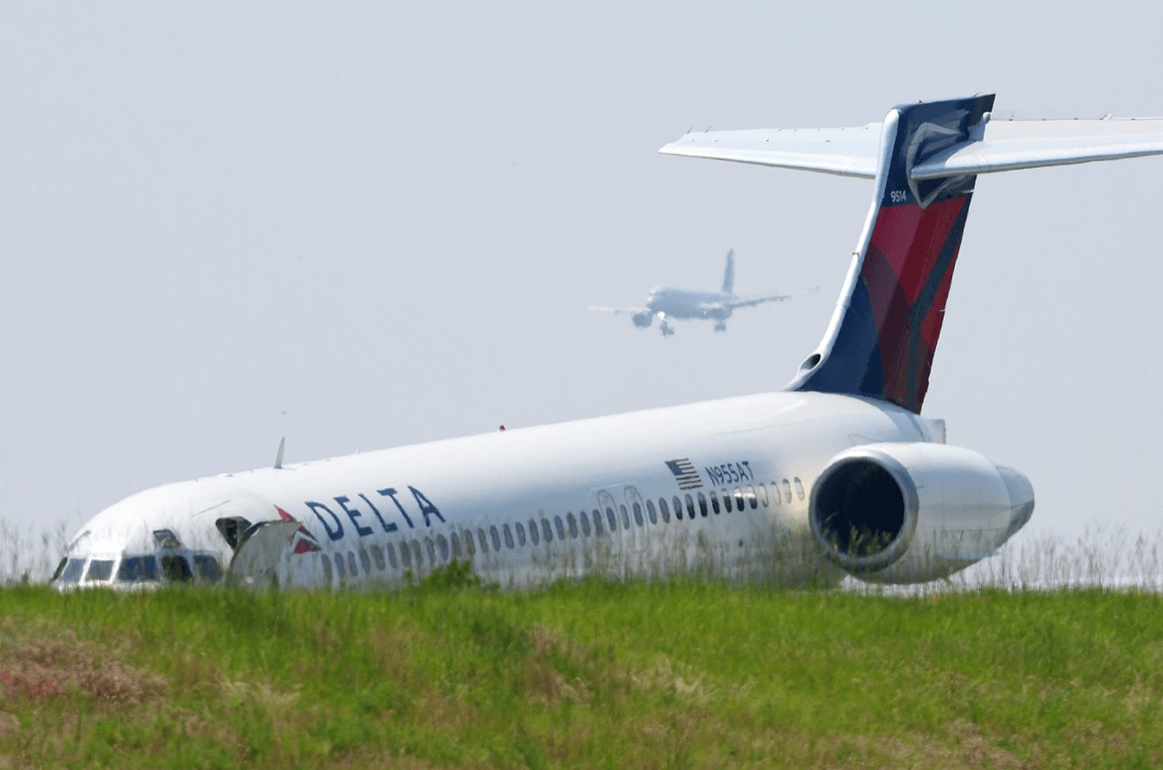 Passengers and crew safely evacuate as a Delta plane lands at Charlotte airport without the proper landing gear.