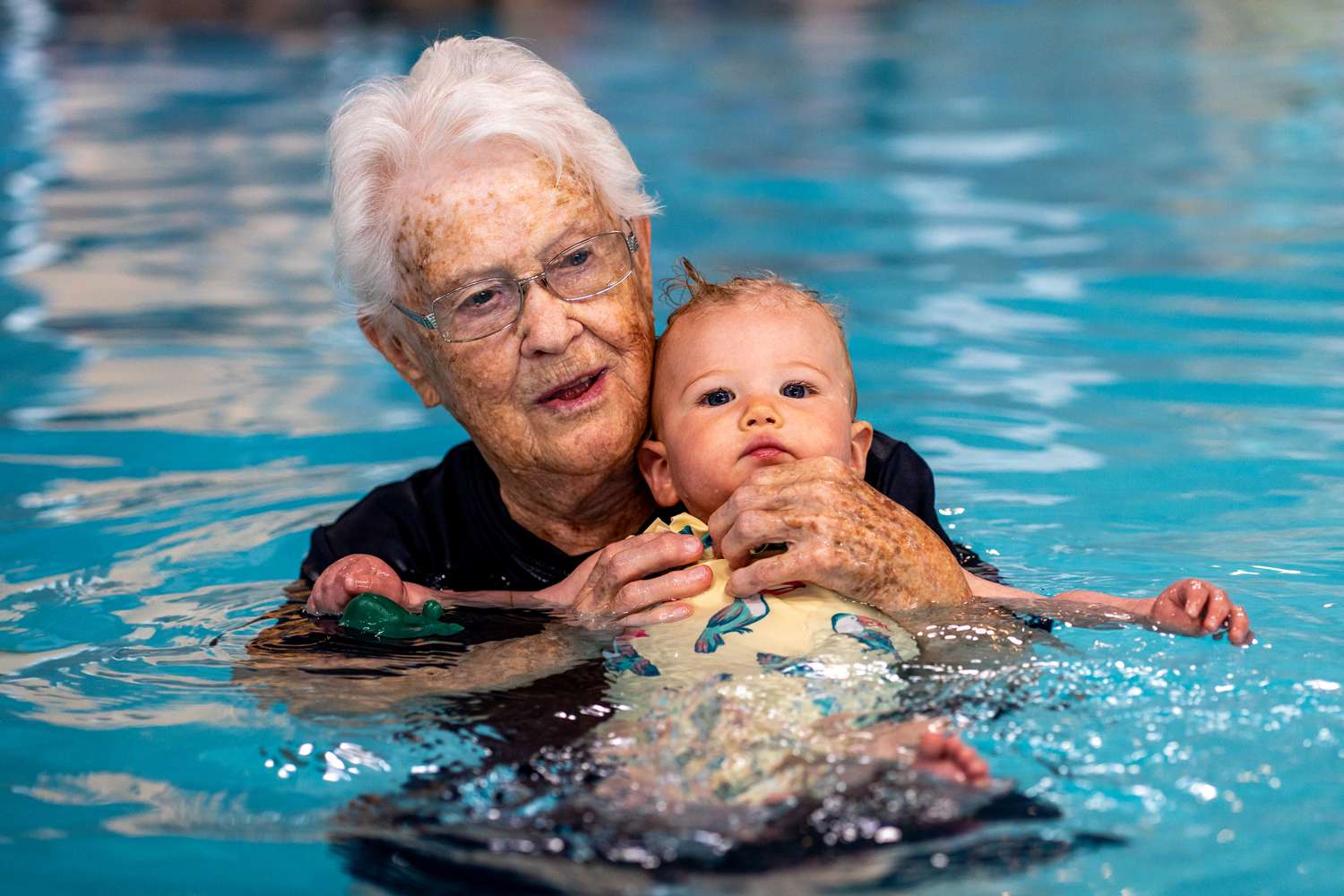 After more than 50 years, a 102-year-old woman is still teaching babies to swim.