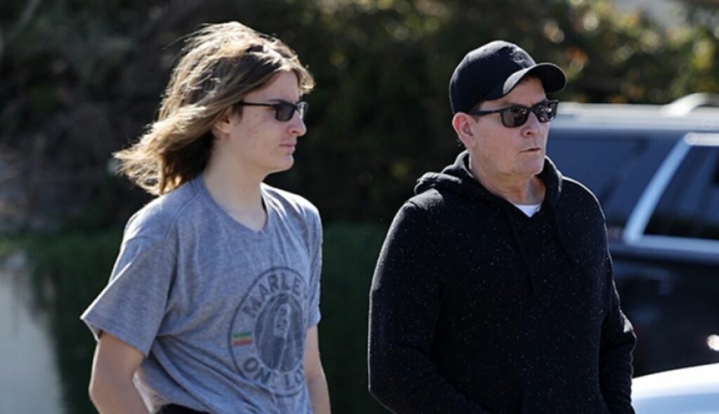 Charlie Sheen’s twins, both 14 years old, are taller than him in photographs in a rare public appearance together.