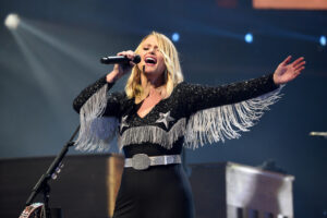 Miranda Lambert yells out to supporters during a concert, and the audience is not impressed.