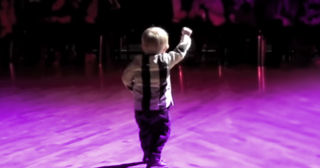 A child rushes to the dance floor as he hears his favorite Elvis song, making the King PROUD.