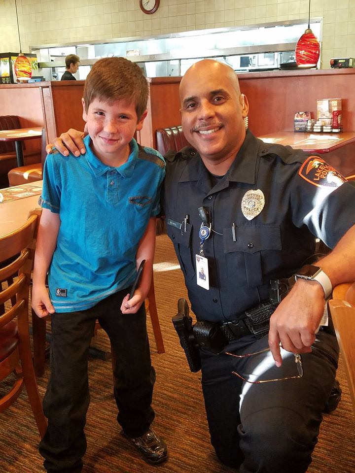 A Heartwarming Gesture: Young Boy Brightens Police Officer’s Day