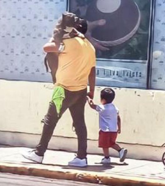 A Touching Moment: Father’s Love for His Dog and Child