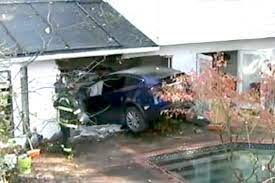 Woman’s Tesla goes for a wild ride, flying over a swimming pool and crashing into a house