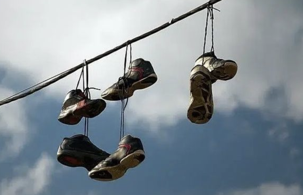 The Mystery Behind Sneakers Hanging from Power Lines